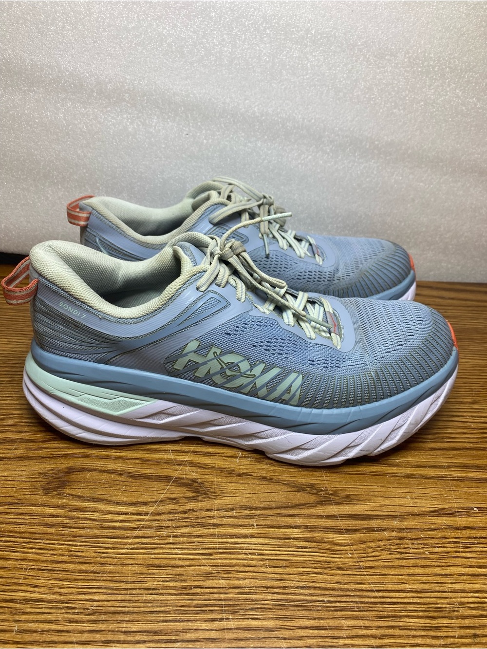 Hoka Women's Light Blue and Mint Bondi 7 Running Shoes with Coral Accents